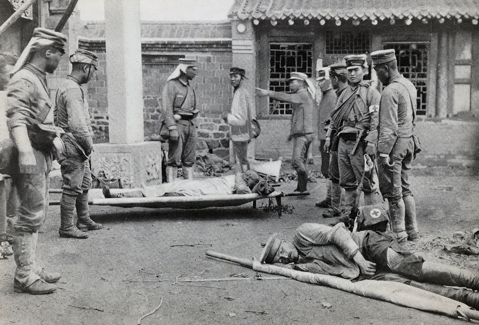 Bringing Wounded Russians to the Dressing Station at the Kwantei Temple on July 4 page 112, A Photographic Record of the Russo-Japanese War, Edited by James H. Hare 1905, PF Collier & Son, New York
