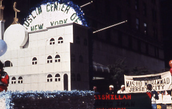 Float of the Queens Muslim Center, with sign of the basmala (In the name of Allah, the compassionate, the merciful).