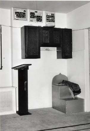 Temporary quarters of the Queens Muslim Center: kitchen cabinets serve as minbar and mihrab.