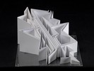Photograph of white model with decreasing height of extruded planes.
