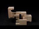 Photograph of bass wood cube model with shifted portions of the cube.