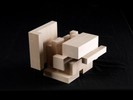 Photograph of bass wood cube model with shifted portions of the cube.