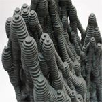 Photograph of gray stacked discs in multiple bundles.