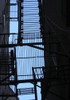 An image of the Space Between:  A fire escape between buildings in Boston's North End.