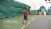 Leaning on the left foot, the ball is tossed up into the air, with the racket staying behind the head.