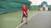 As the racket swings forward, the player keeps it oriented vertically.