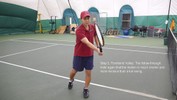At the end of the stroke, the racket is held perpendicular to the arm, not quite in front of the body, with all weight on the left foot.