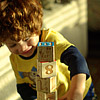 A photo of a boy playing with blocks.