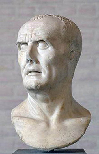 A slightly-damaged bust of a strong-featured gentleman with a receding hairline.