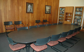 This photo shows the classroom for this course, which has seating for 14 around a central seminar table.