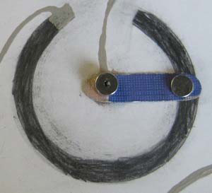 Photo of a paper sensor, using a semi-circle of graphite.