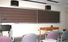21M.355 was taught in a classroom with flexible seating, a piano, an audio system, and a chalkboard with musical staff.