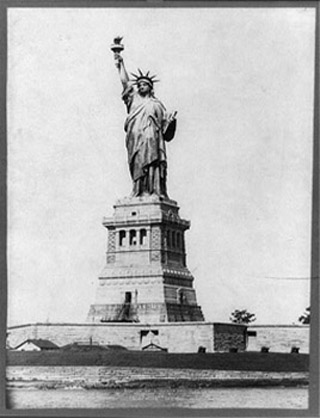 A black and white photograph of the Statue of Liberty.