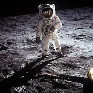 Photo of an astronaut on the surface of the moon.
