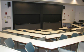 View of the classroom toward the chalkboards in the front.