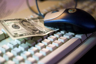 A keyboard, mouse, and five dollar bill.