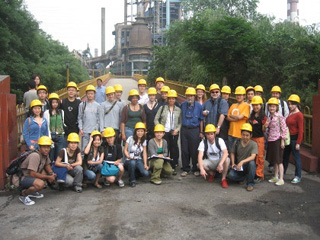 Photograph of studio participants touring the steel factory site.